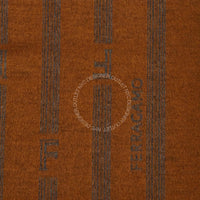Close-up of a brown fabric with a pattern and 'Ferragamo' branding.