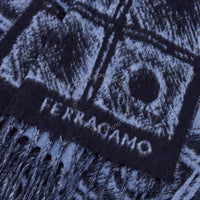 Close-up of a textured fabric with a pattern and 'Ferragamo' branding.