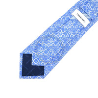 Blue patterned tie with Ferragamo label on a white background
