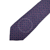 Navy blue tie with pink geometric pattern on a white background
