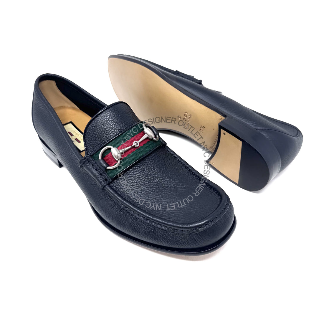 Navy blue loafers on a white background