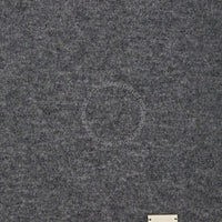 Close-up of gray textured fabric with tag.