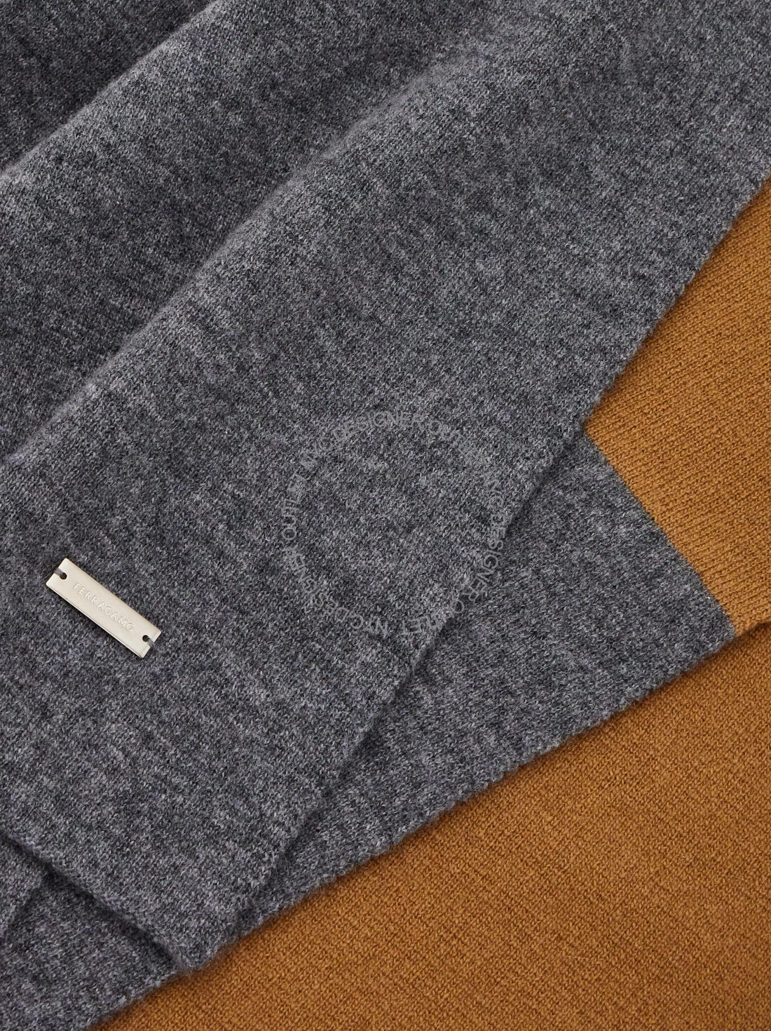 Gray fabric with a label on a brown background