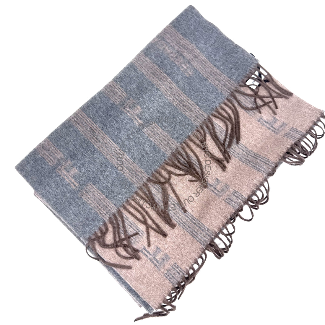 Folded fabric with blue and beige pattern on a white background