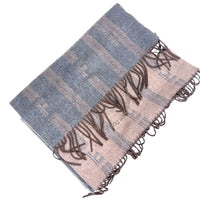 Folded fabric with blue and beige pattern on a white background