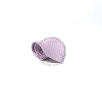 Pink patterned tie on a white background