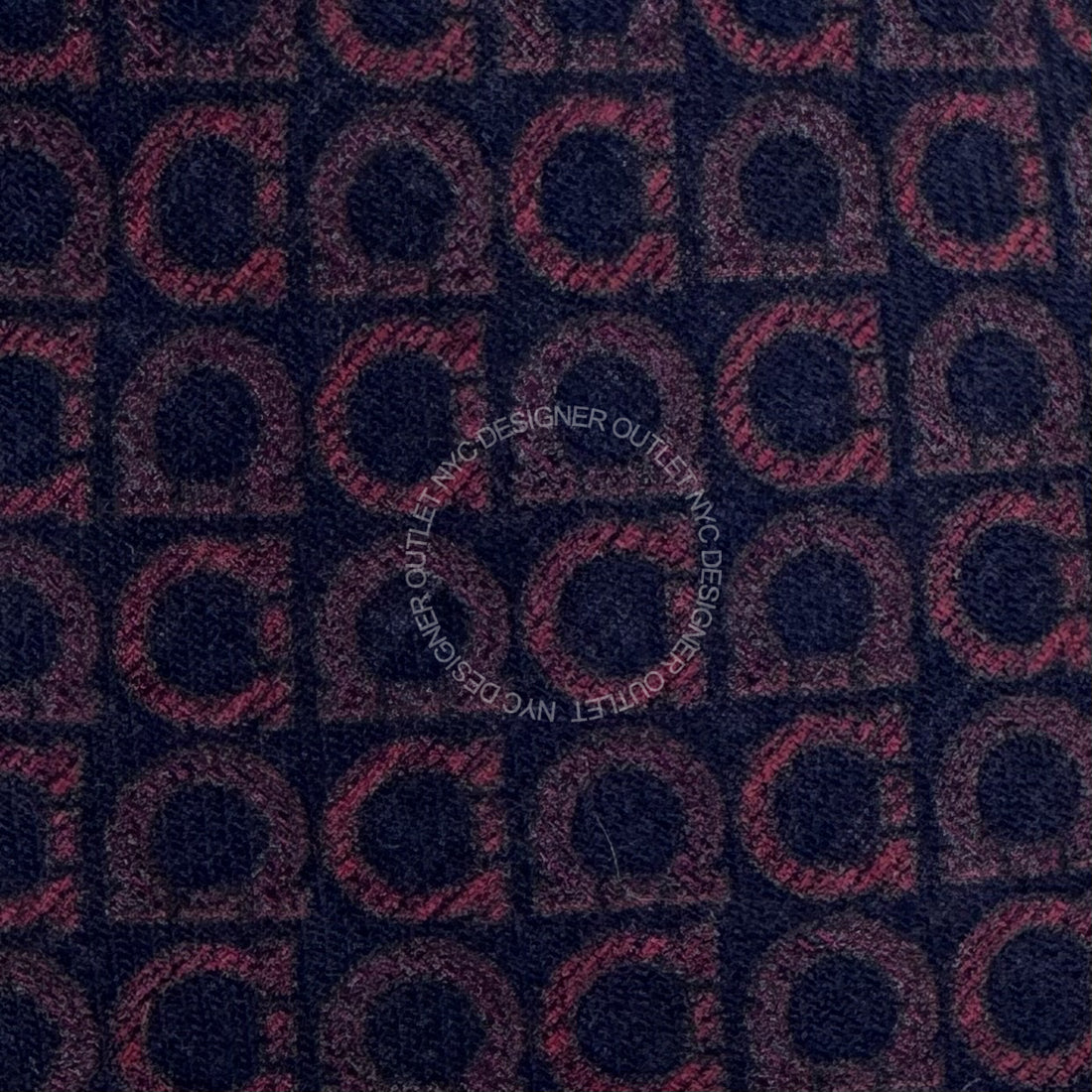 Patterned fabric with a repeated design on a dark background