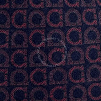 Patterned fabric with a repeated design on a dark background