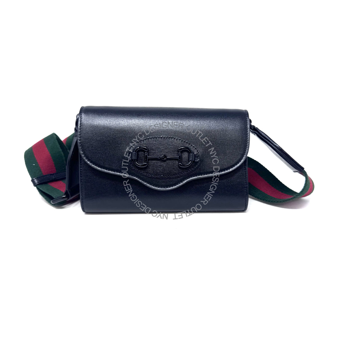 Black handbag with green and red strap on a white background